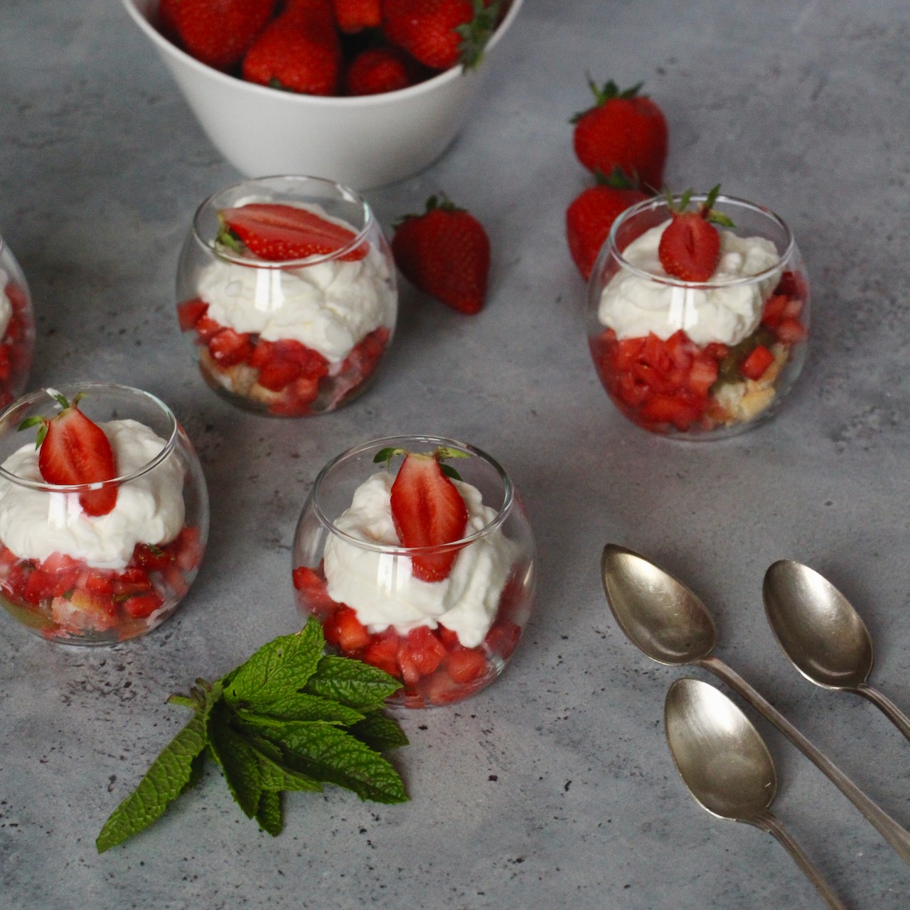 Elegant verrines with fresh strawberries, creamy mousse, a perfect strawberry rhubarb gourmet dessert