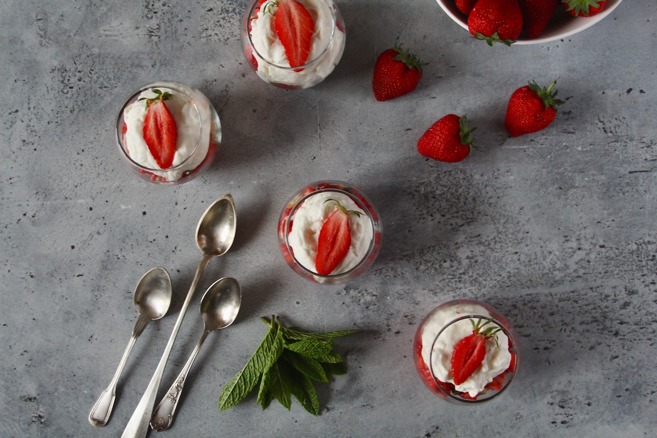 Verrines filled with cream and strawberries, an elegant strawberry rhubarb gourmet dessert