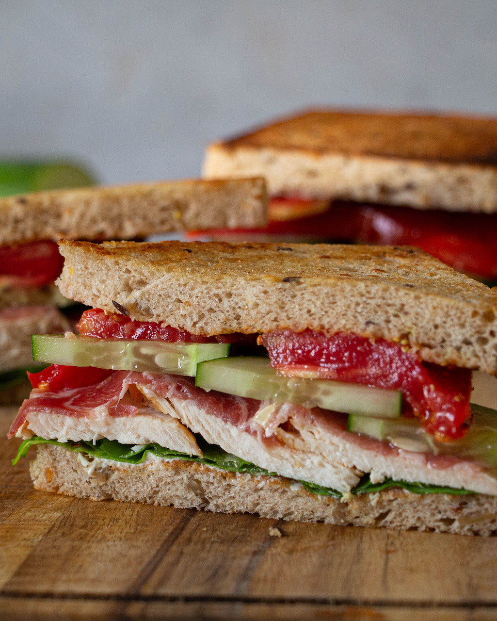 Toasted slices filled with juicy chicken and fresh vegetables in a chicken sandwich