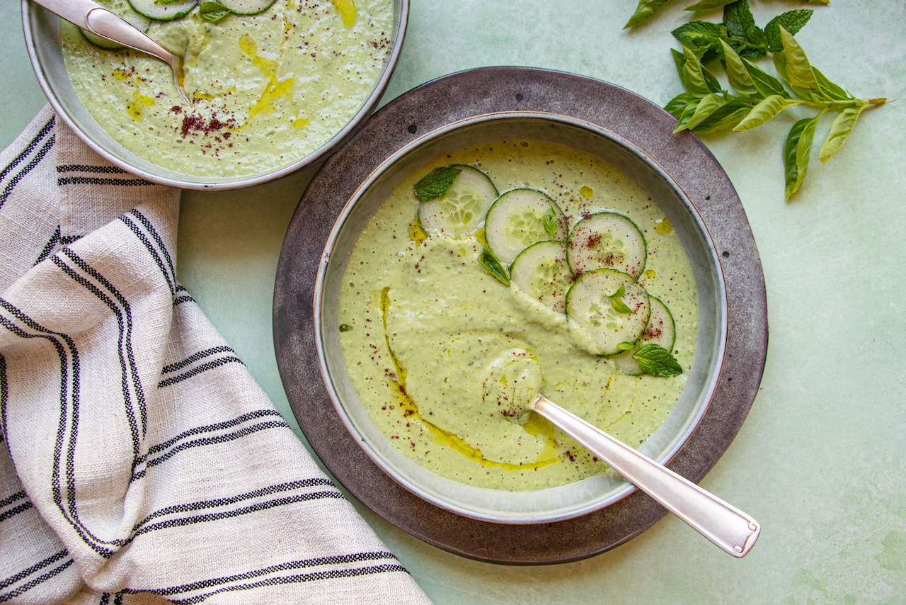 Creamy cucumber gazpacho garnished with cucumber slices and fresh mint