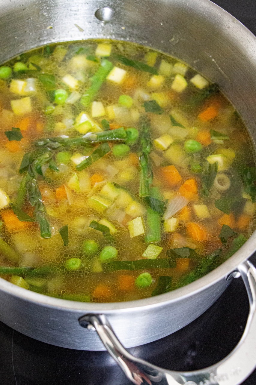 Pot of colorful minestrone, a perfect spring dish for friends