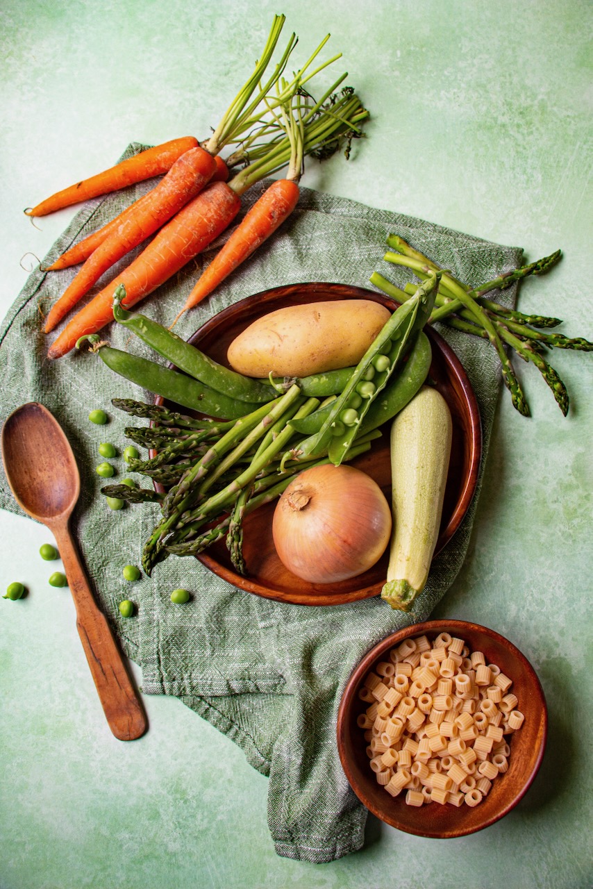 Fresh vegetables and pasta preparing a spring dish for friends