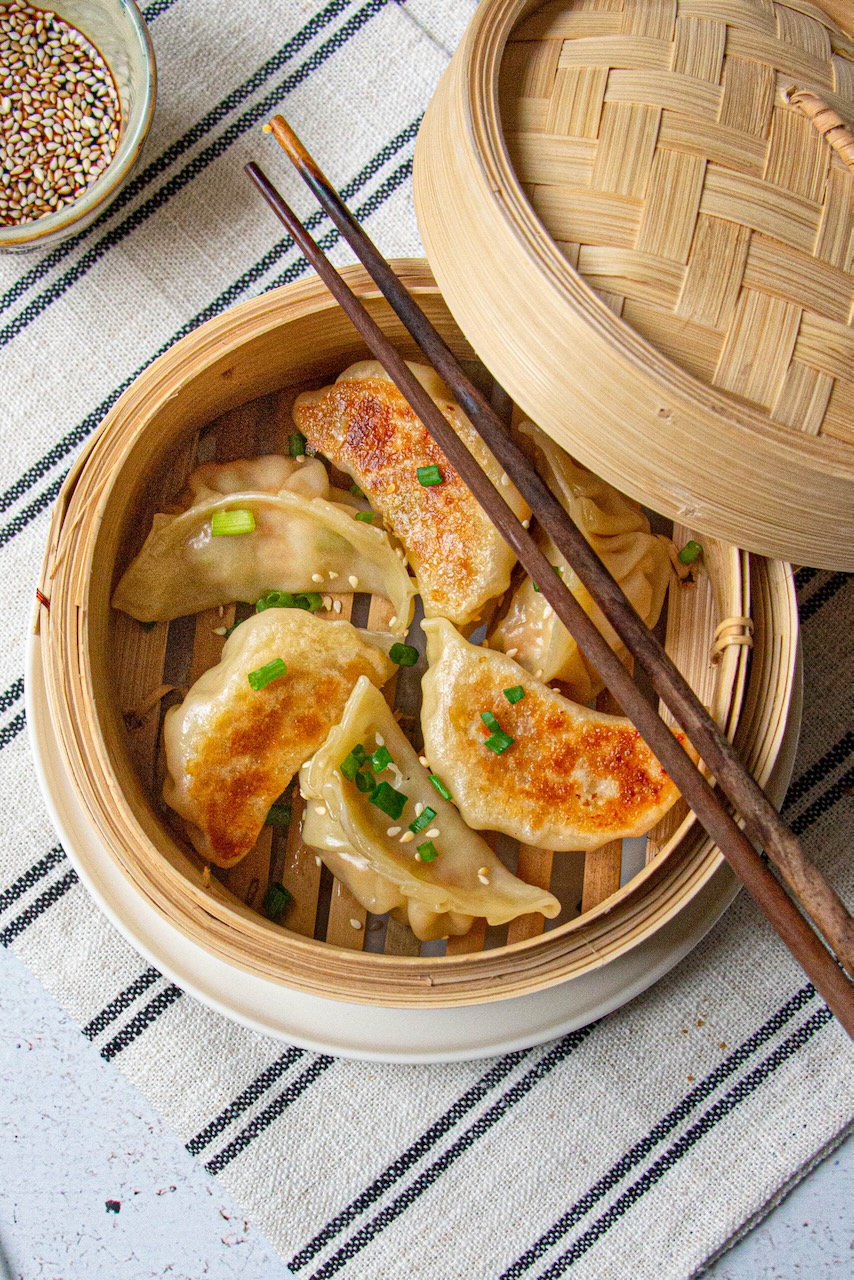 Golden pork gyozas served with soy-vinegar sauce